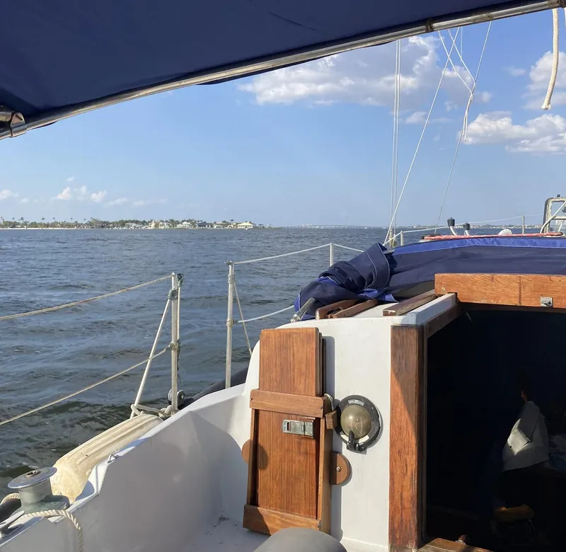 Slide: The Image of 1983 Durbeck 38 sailboat deck with rigging and portholes in sunlight. - 9