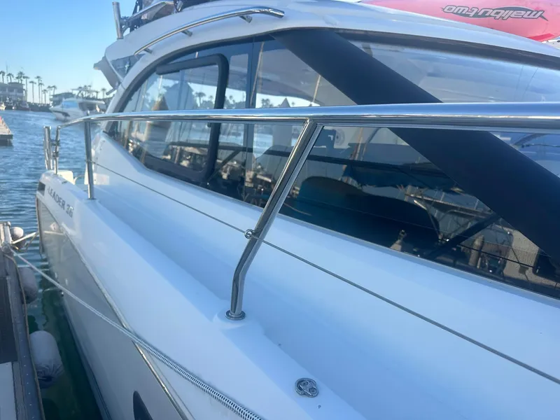 Slide: The Image of 2016 Jeanneau Leader 36 yacht docked at marina, side view. - 6