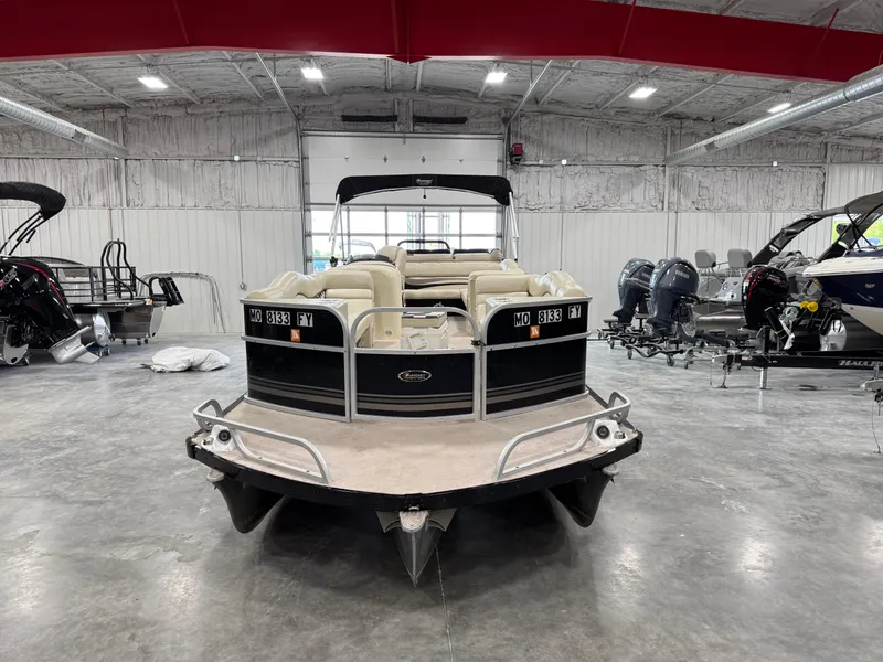 Slide: The Image of 2012 PlayCraft 2700 Extreme pontoon boat in a spacious indoor showroom. - 6