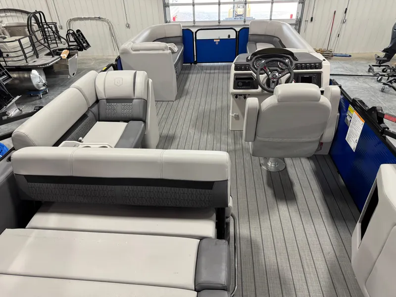 Slide: The Image of 2023 Sweetwater 2286 pontoon boat interior with modern seating and steering console. - 13