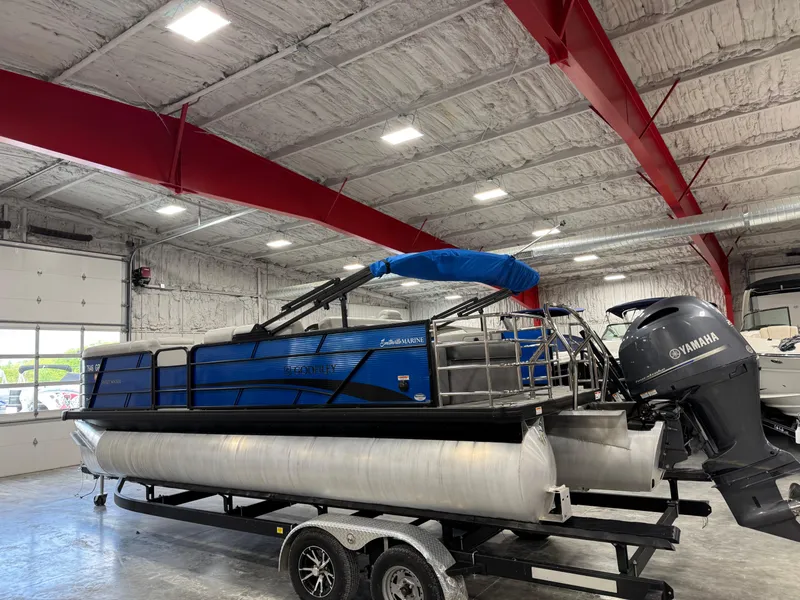 Slide: The Image of 2023 Sweetwater 2286 pontoon boat in a showroom, featuring a Yamaha outboard motor. - 3