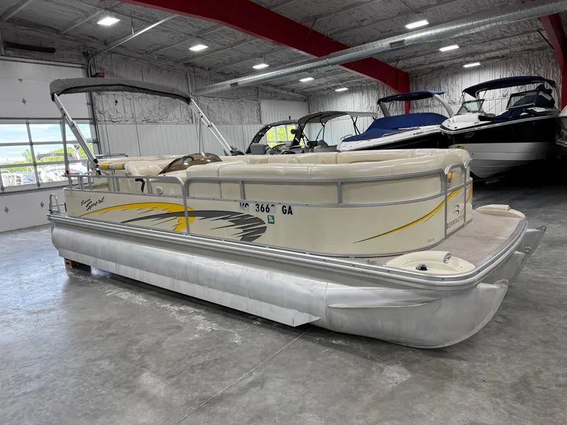 Slide: The Image of 2005 Bennington 2275 RL pontoon boat in indoor storage facility. - 2