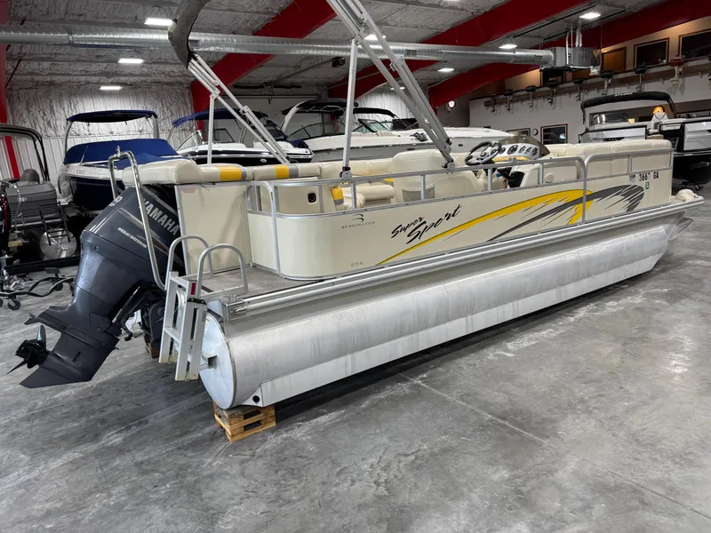 Slide: The Image of 2005 Bennington 2275 RL pontoon boat in a showroom with Yamaha outboard motor. - 3