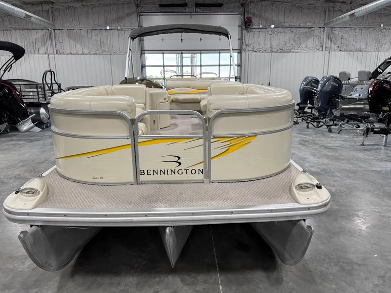 Slide: The Image of 2005 Bennington 2275 RL pontoon boat in a showroom setting. - 5