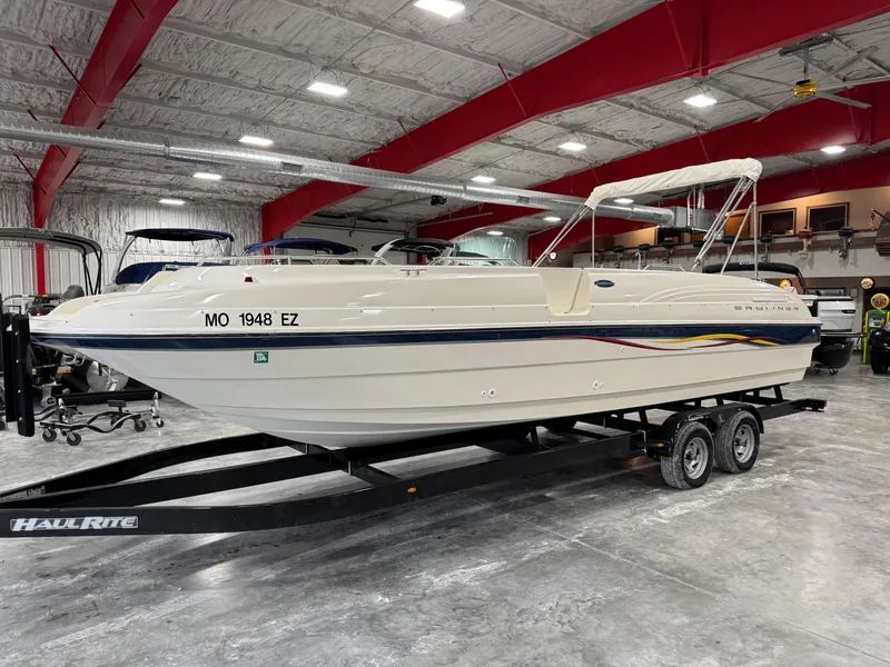 Slide: The Image of 2001 Bayliner 26 Rendevous boat on trailer in indoor storage facility. - 1