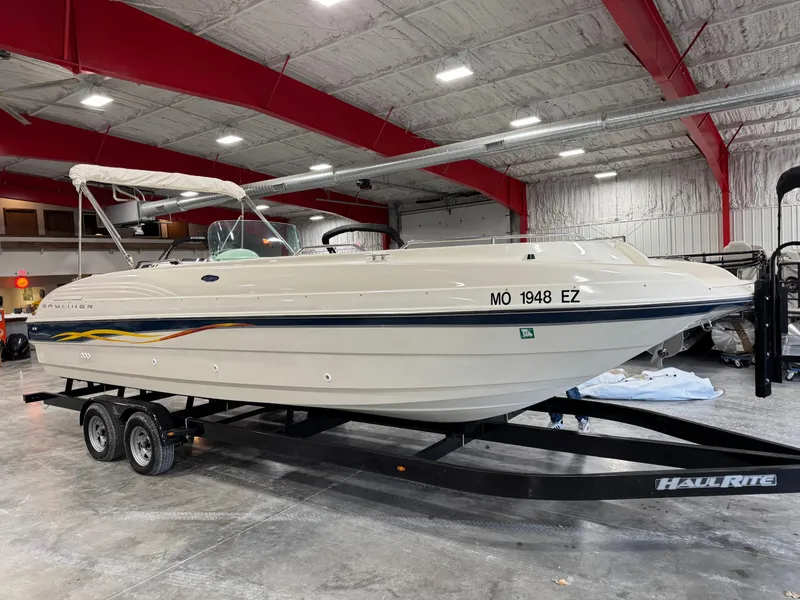 Slide: The Image of 2001 Bayliner 26 Rendevous boat on trailer in indoor storage facility. - 2