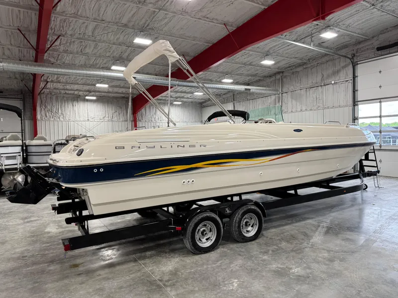 Slide: The Image of 2001 Bayliner 26 Rendevous boat on trailer in indoor storage facility. - 4