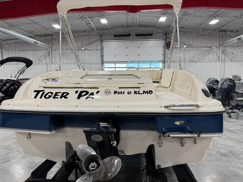 Slide: The Image of 2001 Bayliner 26 Rendevous boat in a warehouse, labeled "Tiger 'PAW', Port of KC, MO". - 6