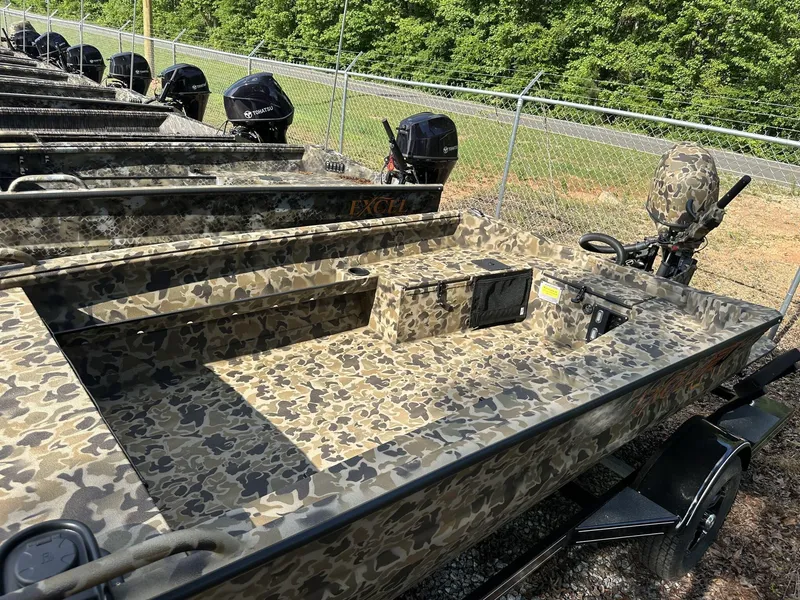 Slide: The Image of Camouflage-patterned 2025 Excel Viper F4 1751 boat with outboard motors, parked outdoors. - 3