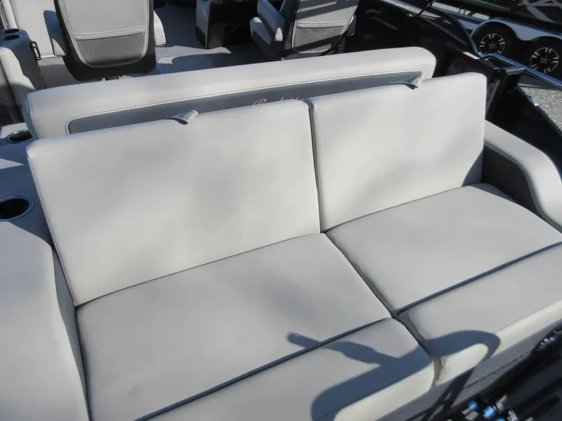 Slide: The Image of 2022 Barletta Cabrio 22UC boat interior with comfortable seating and cup holders. - 10