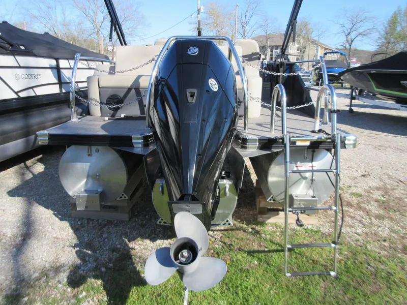 Slide: The Image of 2022 Barletta Cabrio 22UC pontoon boat with outboard motor and ladder, displayed outdoors. - 15