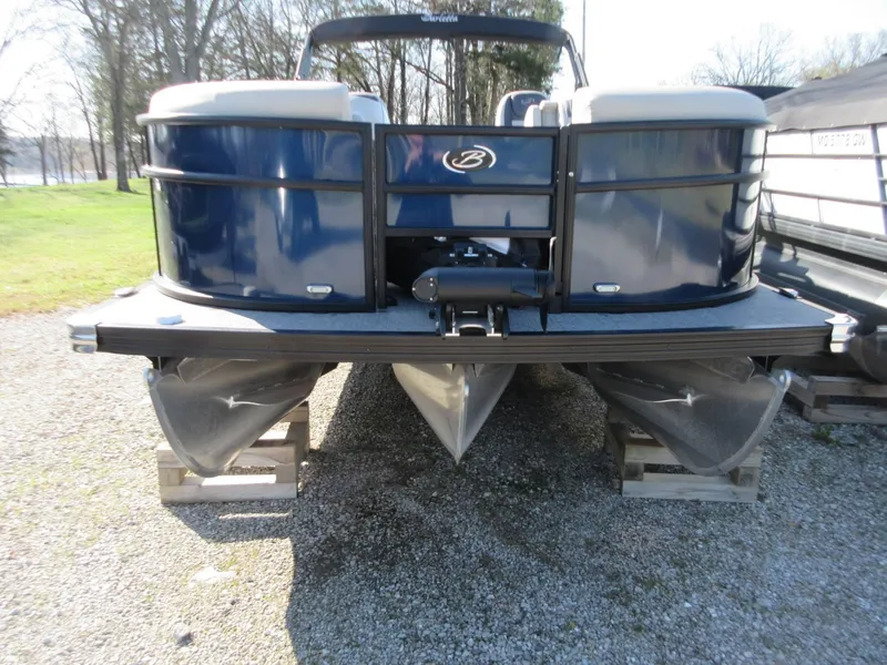 Slide: The Image of 2022 Barletta Cabrio 22UC pontoon boat on gravel, rear view. - 22