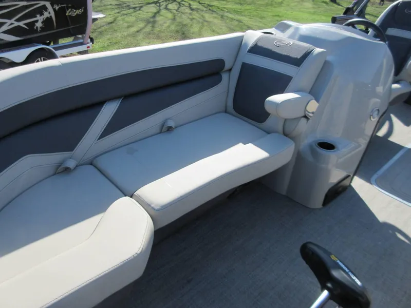 Slide: The Image of 2022 Barletta Cabrio 22UC boat interior with gray seating and console. - 3