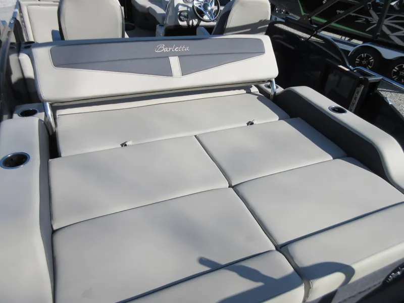 Slide: The Image of 2022 Barletta Cabrio 22UC boat interior with spacious, cushioned seating and cup holders. - 9