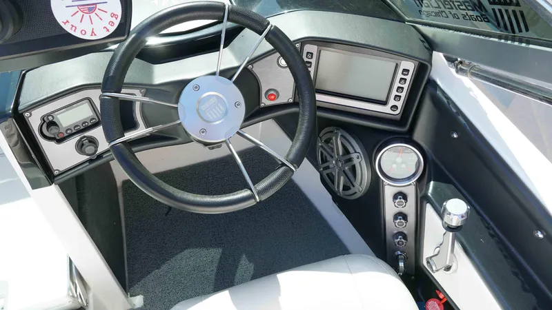 Slide: The Image of 2017 MasterCraft ProStar dashboard with steering wheel, controls, and display screen. - 10