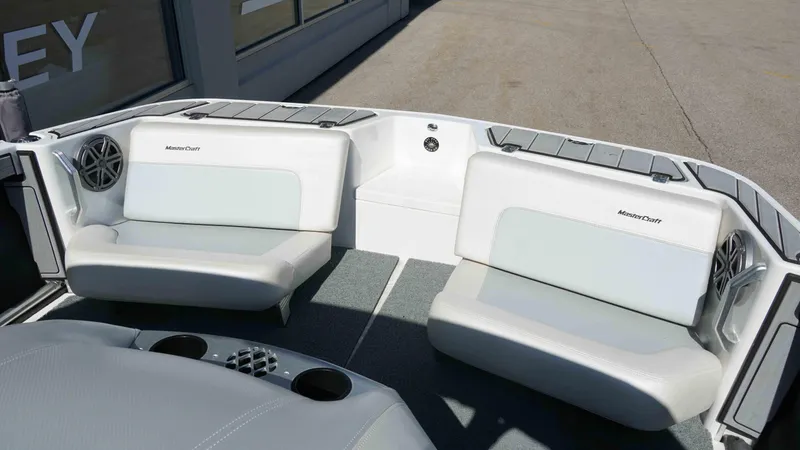 Slide: The Image of 2017 MasterCraft ProStar boat interior with white seating and speaker system. - 4