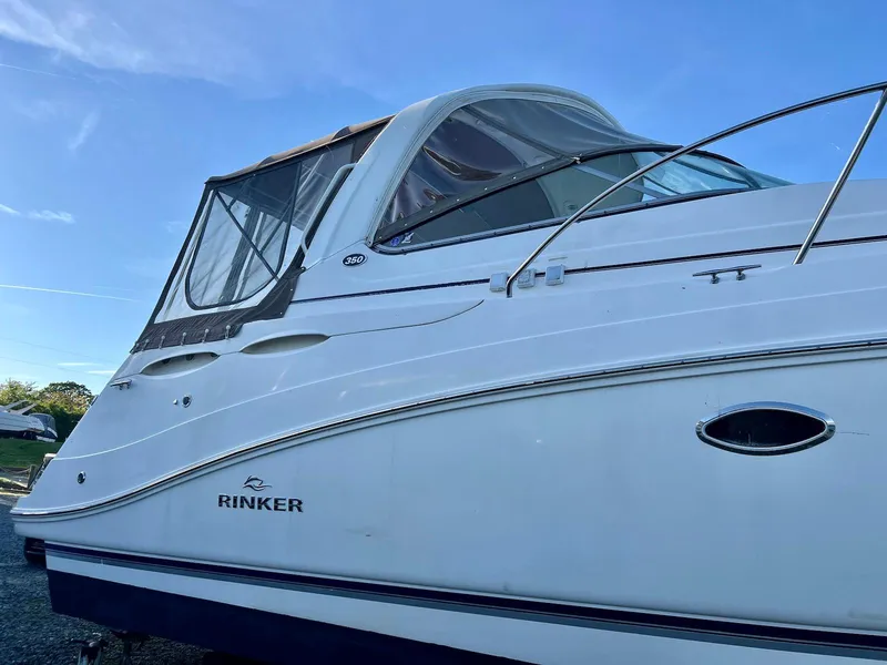 The Image of 2007 Rinker 350 Express Cruiser boat with sleek design and white exterior. - 0