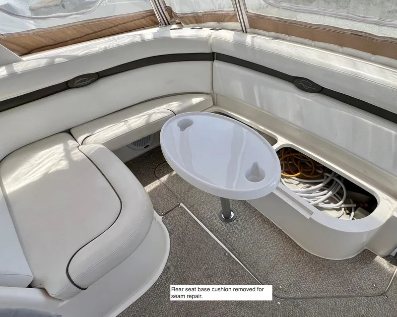 Slide: The Image of 2007 Rinker 350 Express Cruiser interior with seating and storage compartment open. - 10