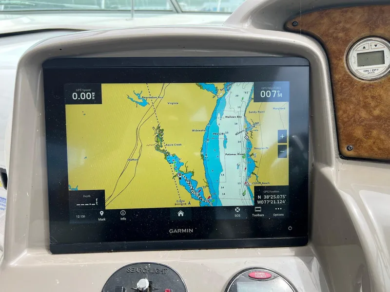 Slide: The Image of Garmin navigation display on 2007 Rinker 350 Express Cruiser dashboard. - 11