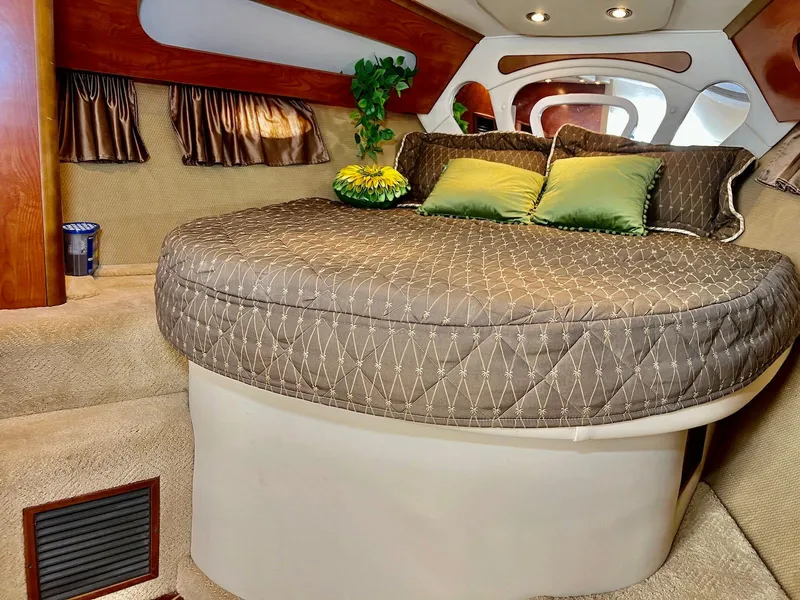 Slide: The Image of Luxurious interior of 2007 Rinker 350 Express Cruiser with cozy bed and elegant decor. - 22