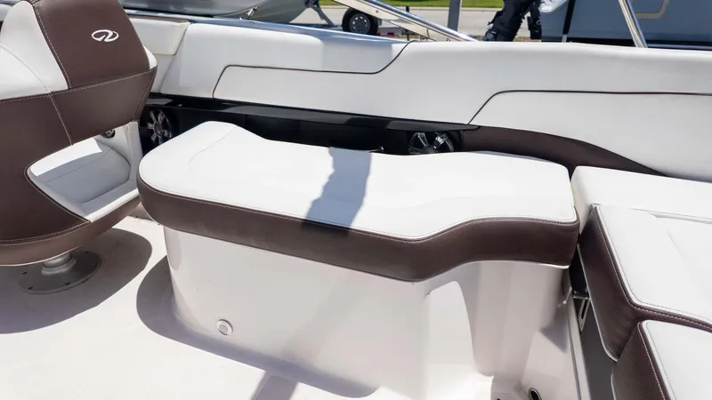 Slide: The Image of 2016 Regal 2300 boat interior with brown and white seating. - 10