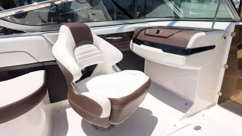 Slide: The Image of 2016 Regal 2300 boat interior with brown and white seating. - 13
