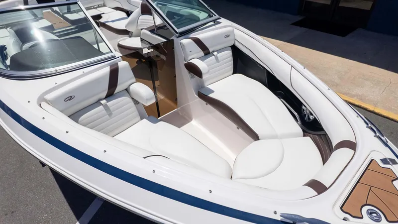 Slide: The Image of 2016 Regal 2300 boat interior with white and brown seating, showcasing luxury design. - 3