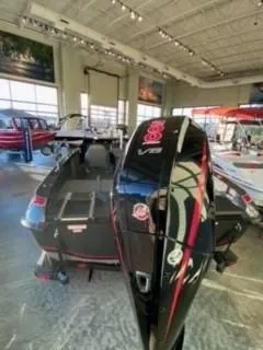 The Image of 2025 Nitro ZV19 boat on trailer, parked outdoors, featuring sleek design and modern features. - 1