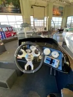 Slide: The Image of Steering console of a 2025 Nitro ZV19 boat, featuring modern gauges and controls. - 4