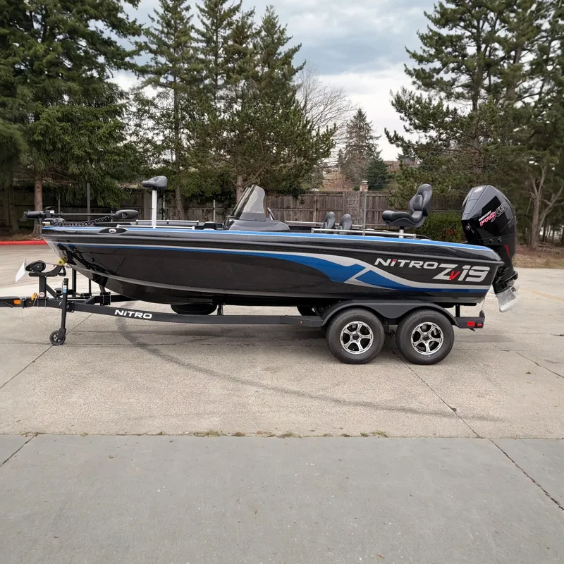 The Image of 2025 Nitro ZV19 boat on trailer, parked outdoors, featuring sleek design and modern features. - 0