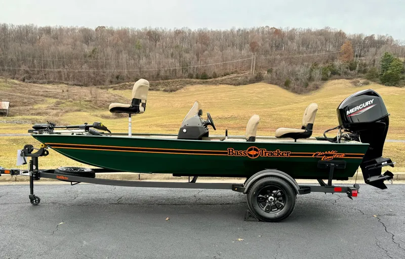 Slide: The Image of 2025 Tracker Bass Tracker Classic Limited boat on trailer, parked outdoors. - 4