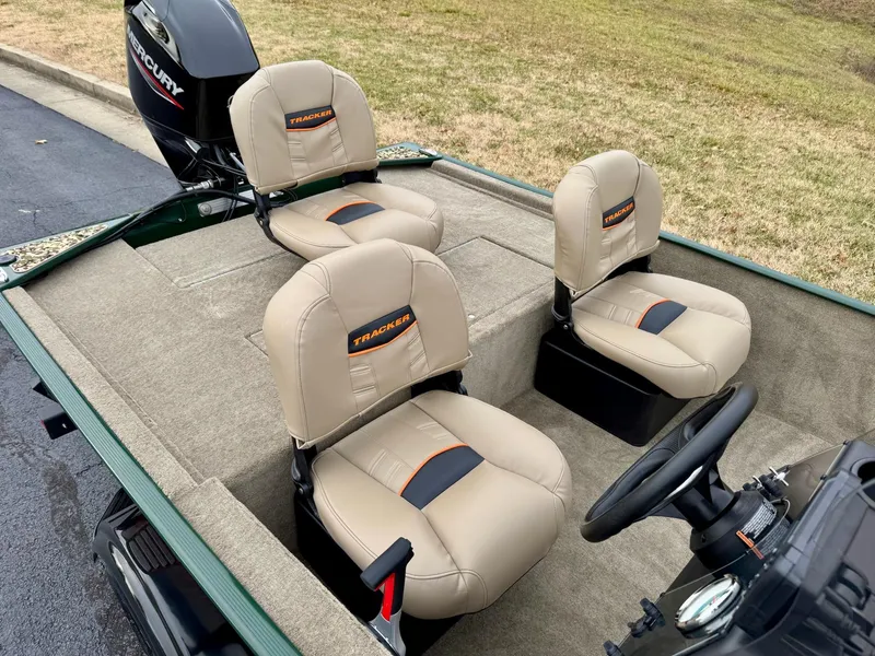 Slide: The Image of 2025 Tracker Bass Tracker Classic Limited boat with beige seats and Mercury engine. - 47