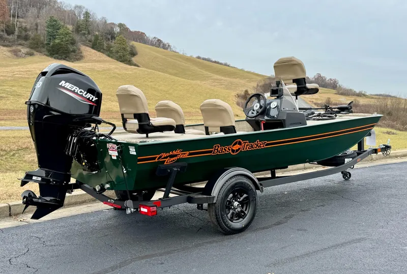 Slide: The Image of 2025 Tracker Bass Tracker Classic Limited boat with Mercury engine on a trailer. - 5