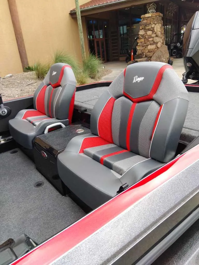 Slide: The Image of 2025 Ranger Z520 boat seats with red and gray design, outdoor setting. - 5
