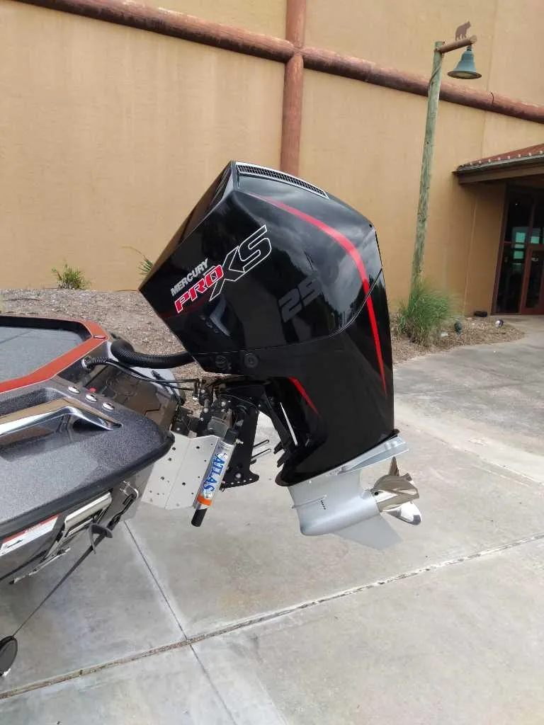 Slide: The Image of 2025 Ranger Z520 boat with Mercury Pro XS outboard motor, parked outdoors. - 7