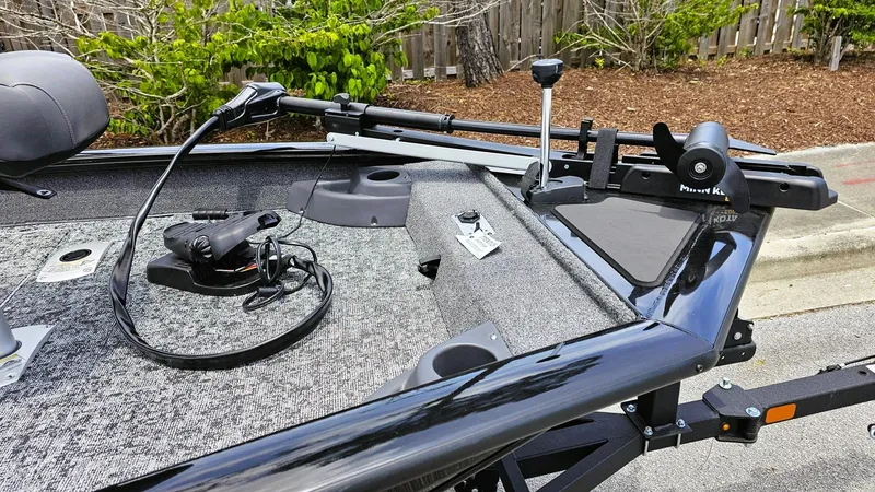 Slide: The Image of 2025 Tracker Pro Team 175 Crappie Edition boat deck with fishing equipment. - 11