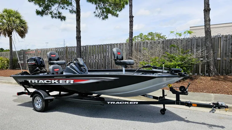 Slide: The Image of 2025 Tracker Pro Team 175 Crappie Edition boat on trailer, parked outdoors. - 3