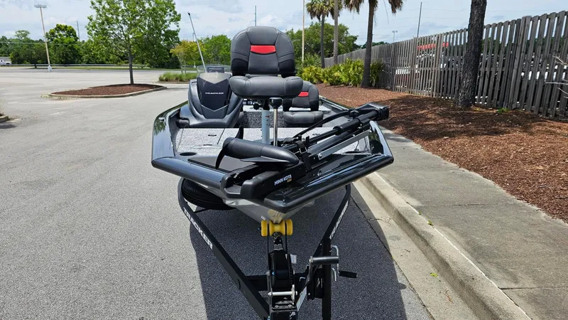 Slide: The Image of 2025 Tracker Pro Team 175 Crappie Edition boat parked on pavement, front view. - 5