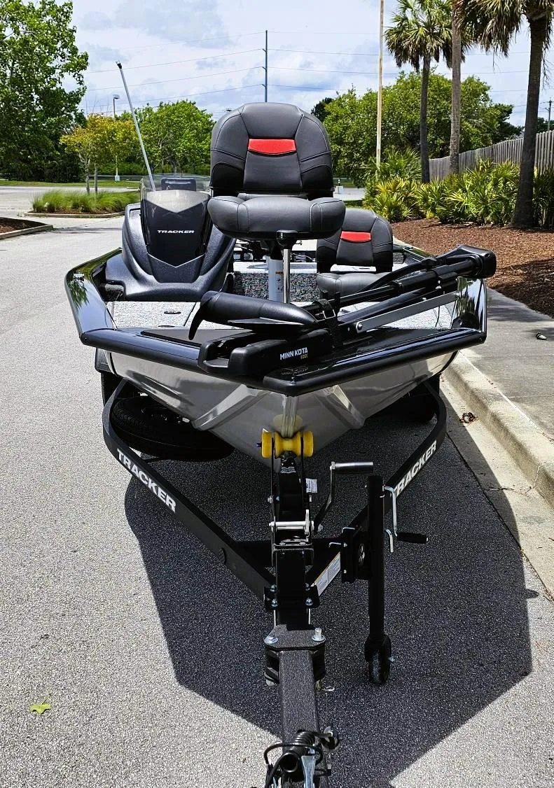 Slide: The Image of 2025 Tracker Pro Team 175 Crappie Edition boat parked on a sunny street. - 6
