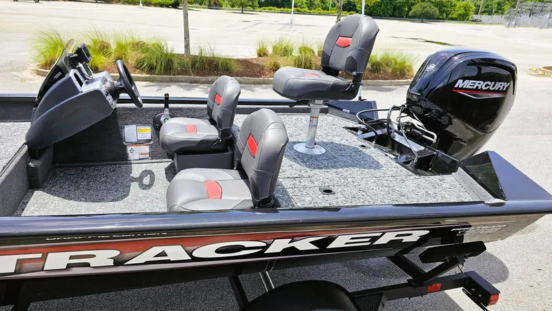Slide: The Image of 2025 Tracker Pro Team 175 Crappie Edition boat with Mercury engine, featuring comfortable seating. - 8