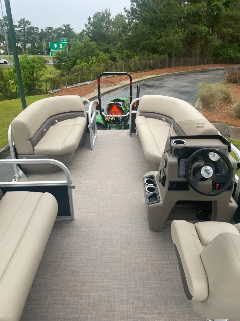 Slide: The Image of 2025 Sun Tracker Party Barge 16 DLX pontoon boat with spacious seating and modern design. - 2