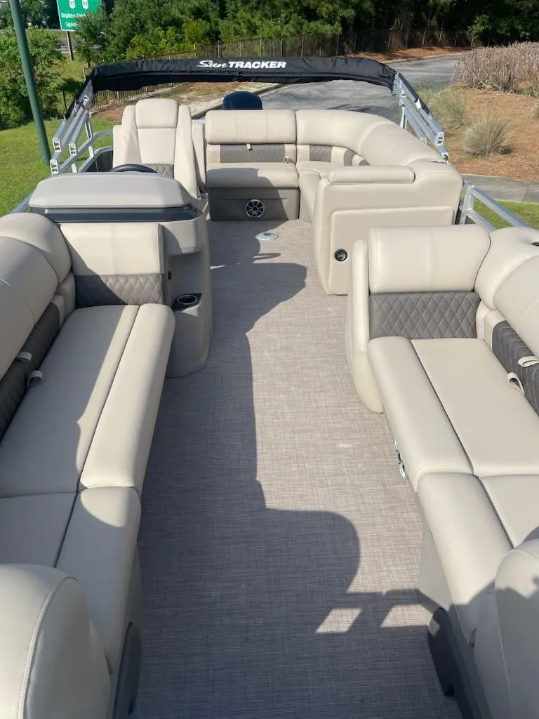 Slide: The Image of 2025 Sun Tracker Party Barge 20 DLX with spacious seating and modern design. - 2