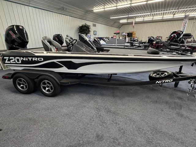 Slide: The Image of 2024 Nitro Z20 Pro boat in showroom, featuring sleek design and dual motors. - 0