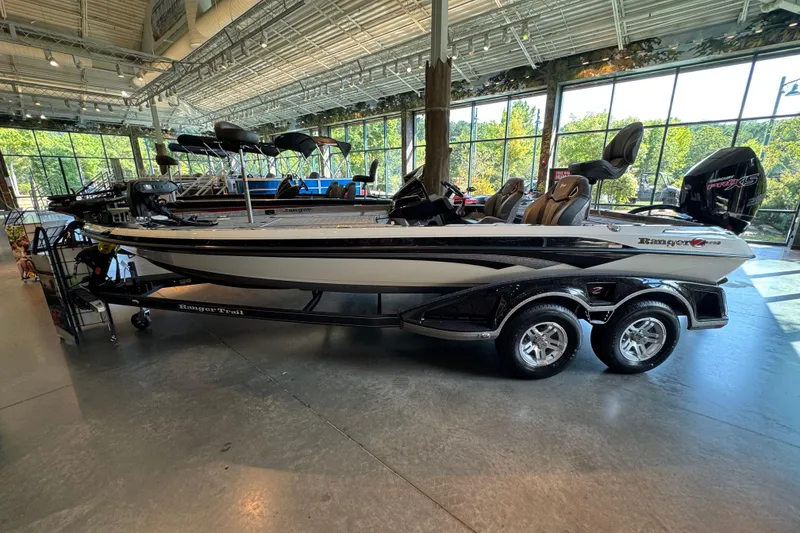 The Image of 2025 Ranger Z520R boat displayed in a showroom with modern interior and exterior design. - 0