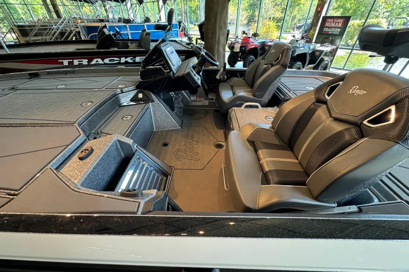 Slide: The Image of 2025 Ranger Z520R boat interior with sleek seating and modern dashboard. - 2