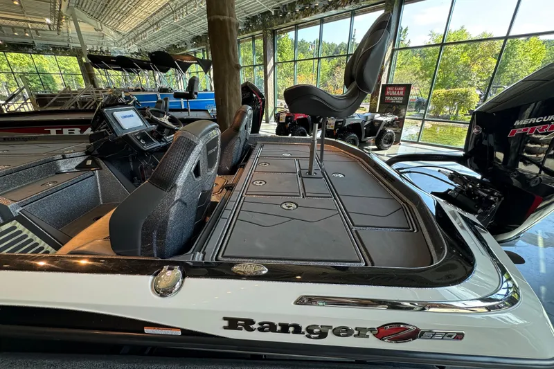 Slide: The Image of 2025 Ranger Z520R boat interior with advanced seating and control panel in showroom. - 5