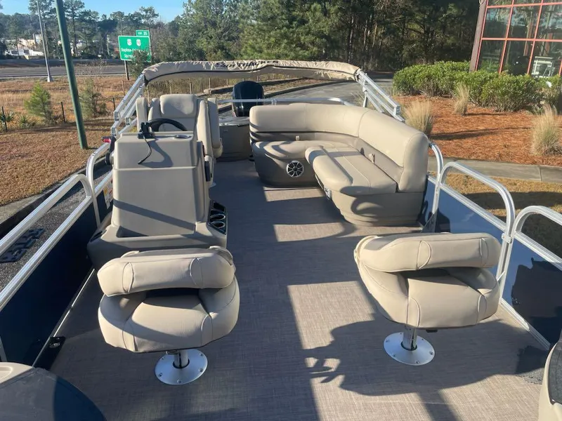 Slide: The Image of 2025 Sun Tracker Bass Buggy 18 DLX pontoon boat with spacious seating and modern design. - 4