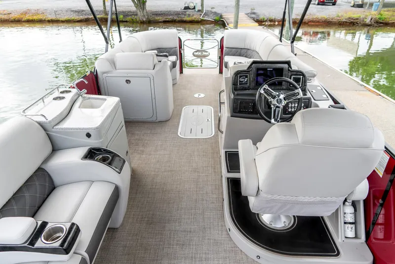 Slide: The Image of 2021 G3 SunCatcher Elite 326 Cruise pontoon boat interior with plush seating and modern helm. - 11