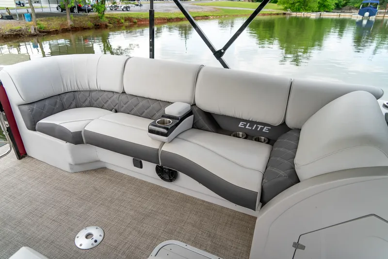 Slide: The Image of Luxurious seating on 2021 G3 SunCatcher Elite 326 Cruise pontoon boat by the water. - 17