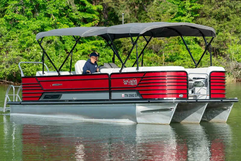 Slide: The Image of 2021 G3 SunCatcher Elite 326 Cruise pontoon boat on a serene lake. - 3